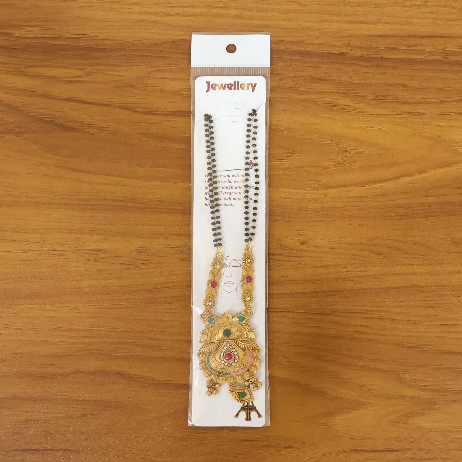 Traditional Indian jewelry featuring Kalamash pot pendant with contrasting enamel in green and pink