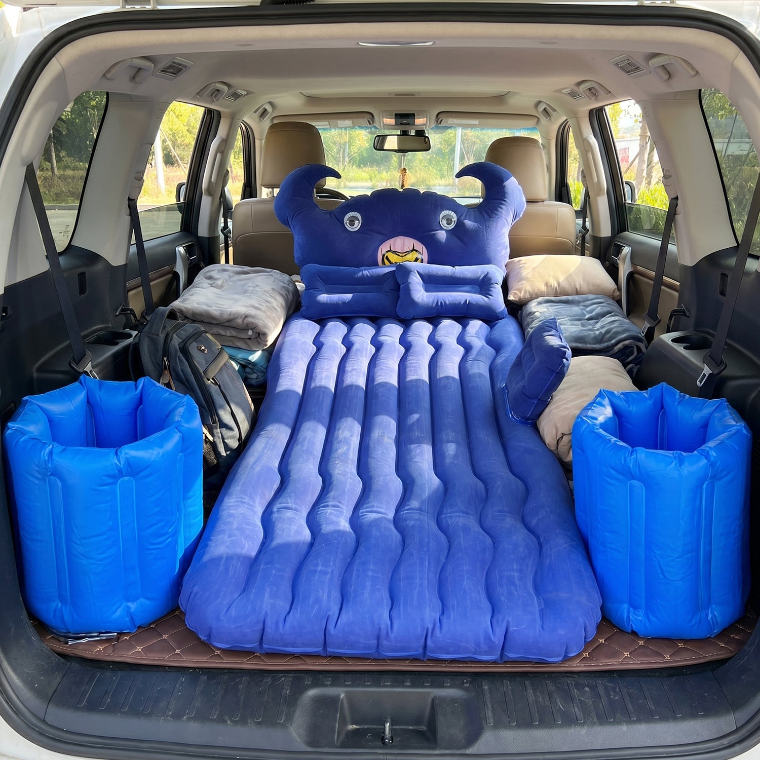 Inflatable bed set on car back seat with pump