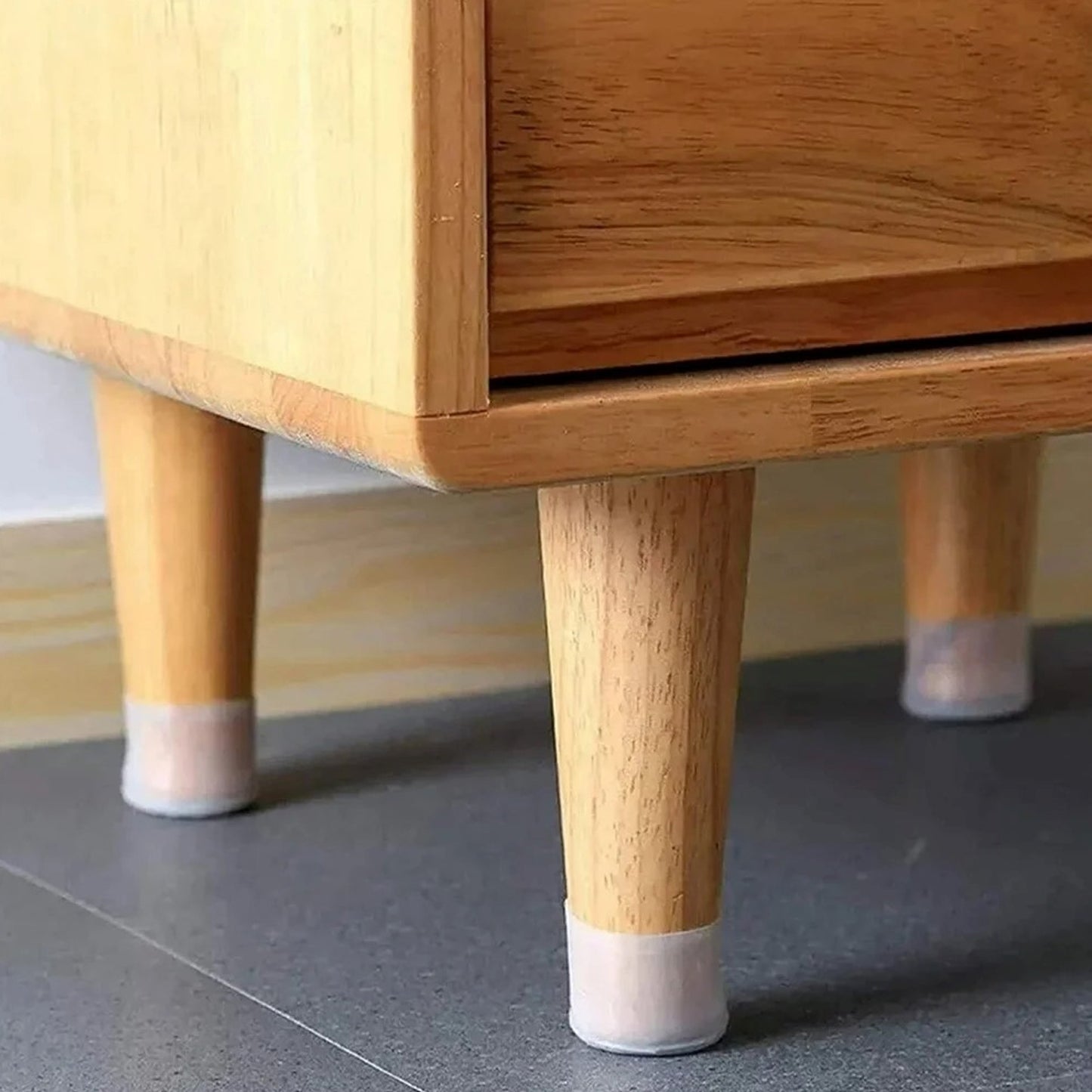 Silicone furniture pads protecting chair legs