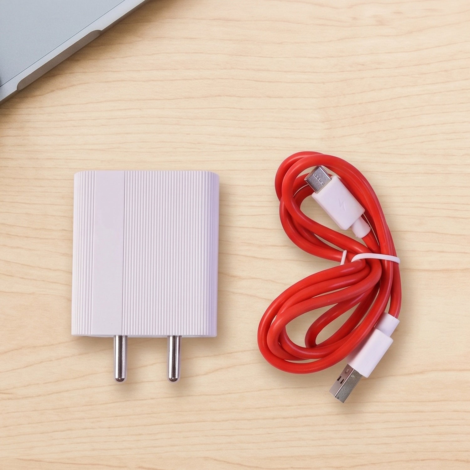 Red USB to Type-C charging cable in hand