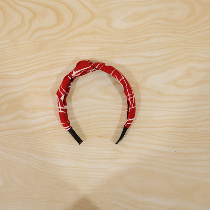 Printed knot design hairband worn in style
