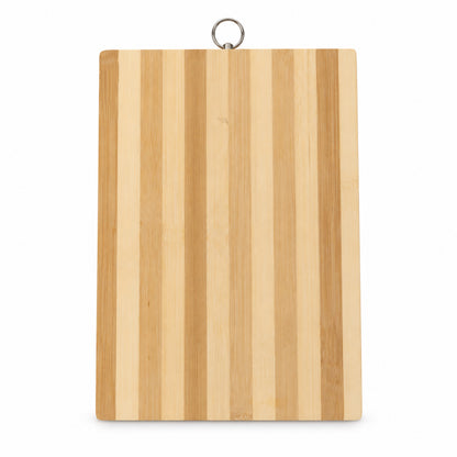 A rectangular bamboo cutting board with alternating light and dark wood stripes hangs against a white background.
