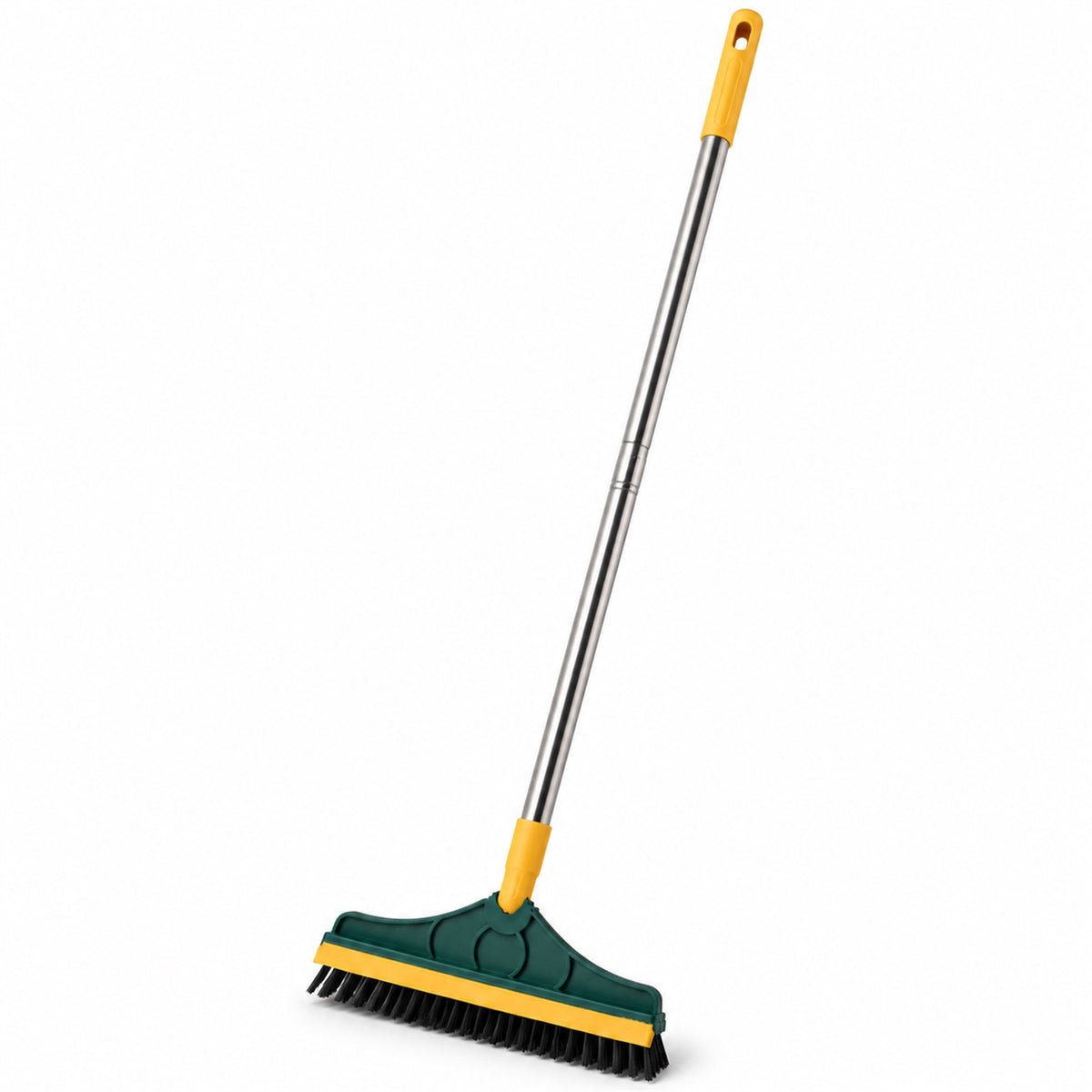 A green and yellow floor cleaning brush with a long metal handle is angled on a white background, showcasing its design.