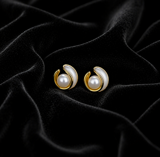 Elegant gold pearl stud earrings for women on white background