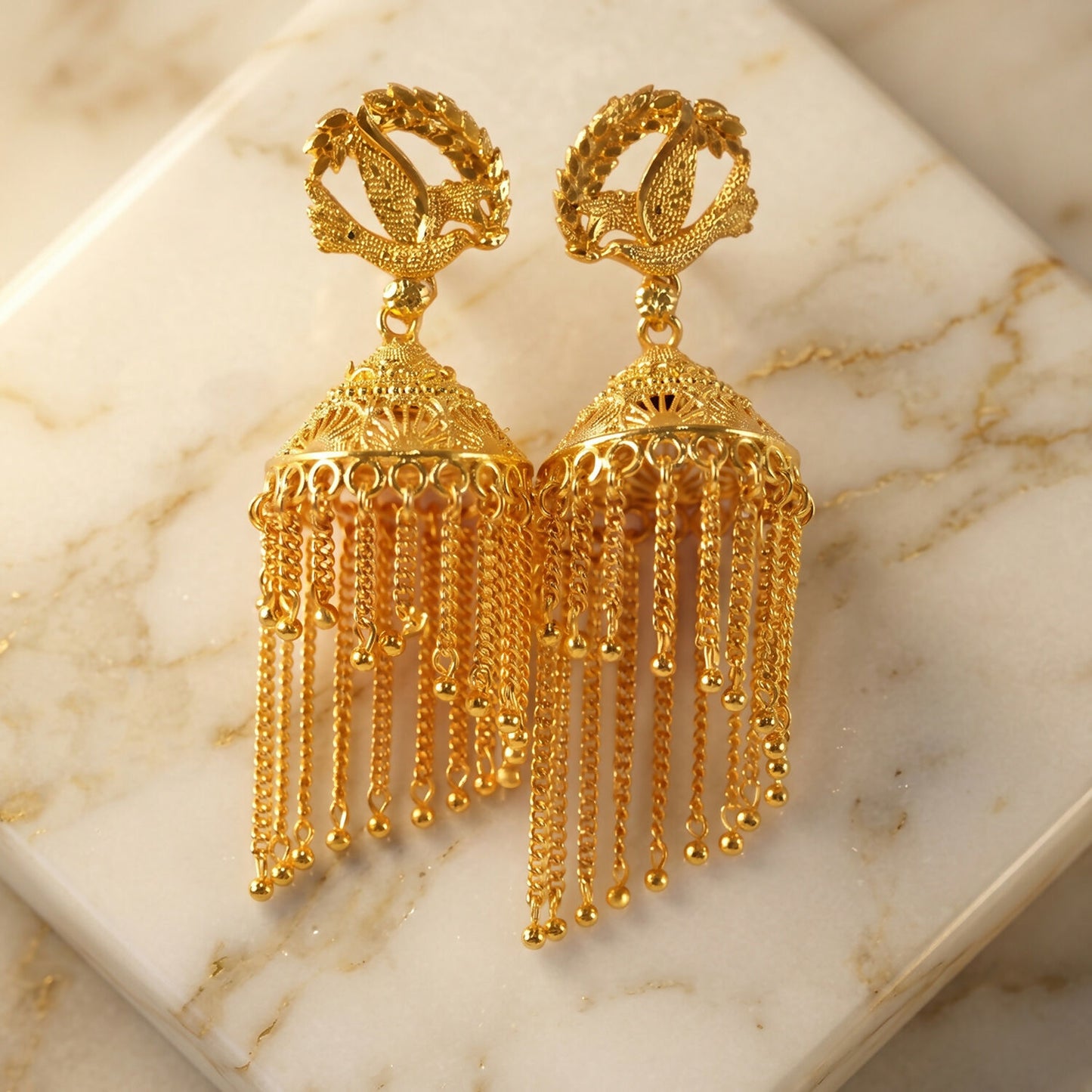 Golden Leaf Tassel Jhumka Earrings display image