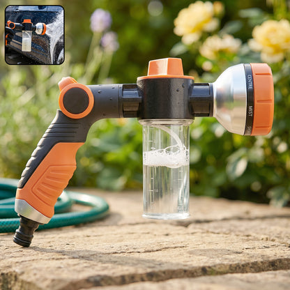 Close-up of handheld garden hose spray nozzle with adjustable head and foam feature