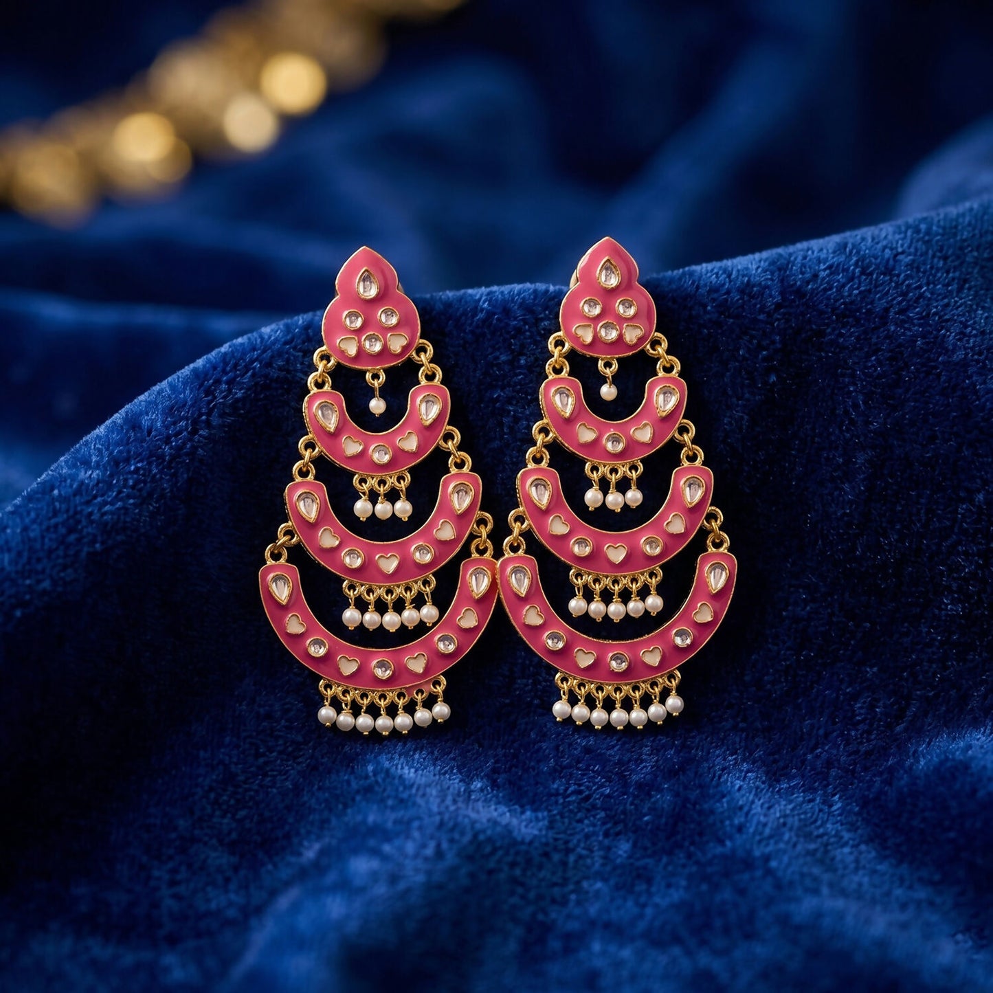 Gold-tone detailing on black layered chandbali earrings