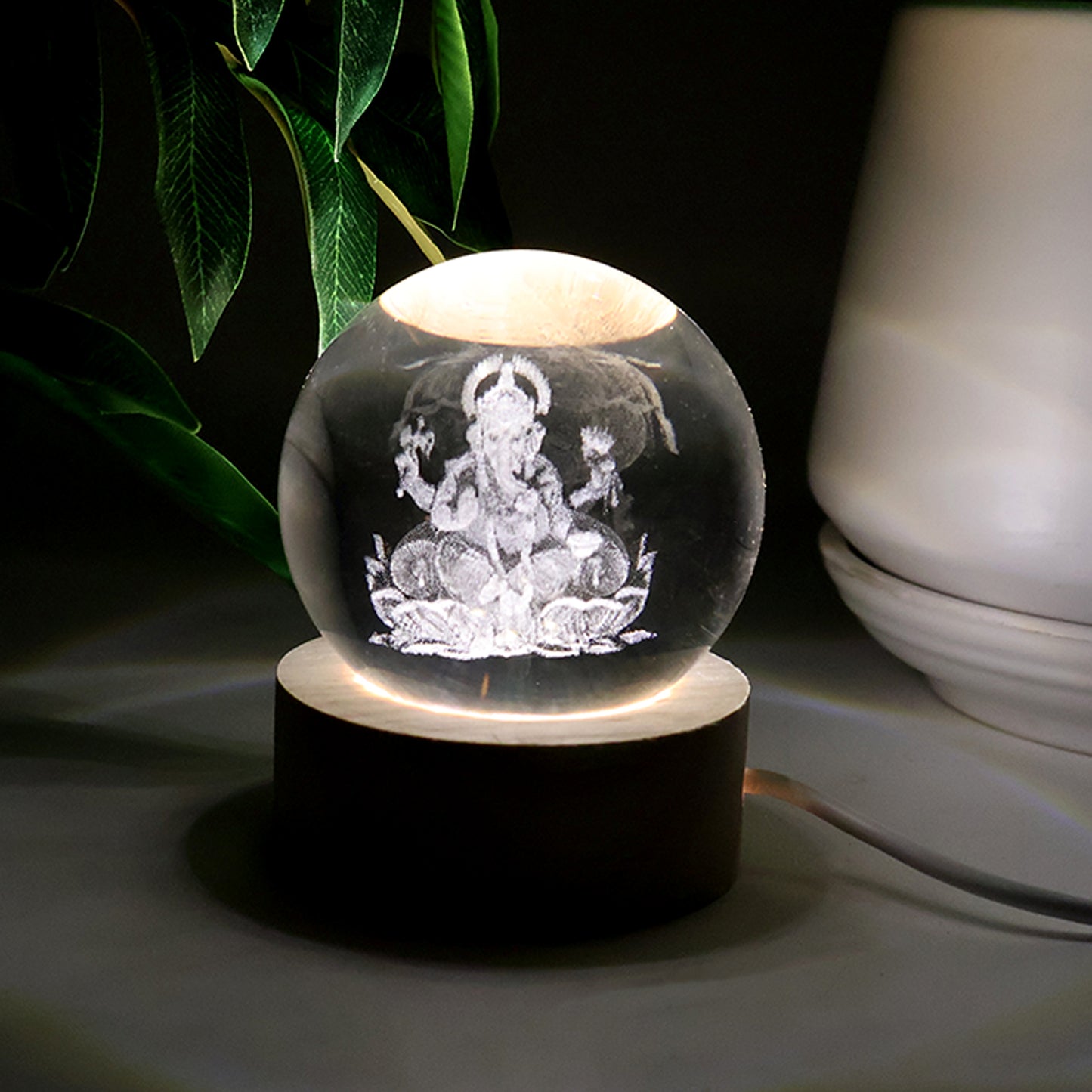 Close-up of Ganpati 3D Crystal Ball Lamp lighting effect