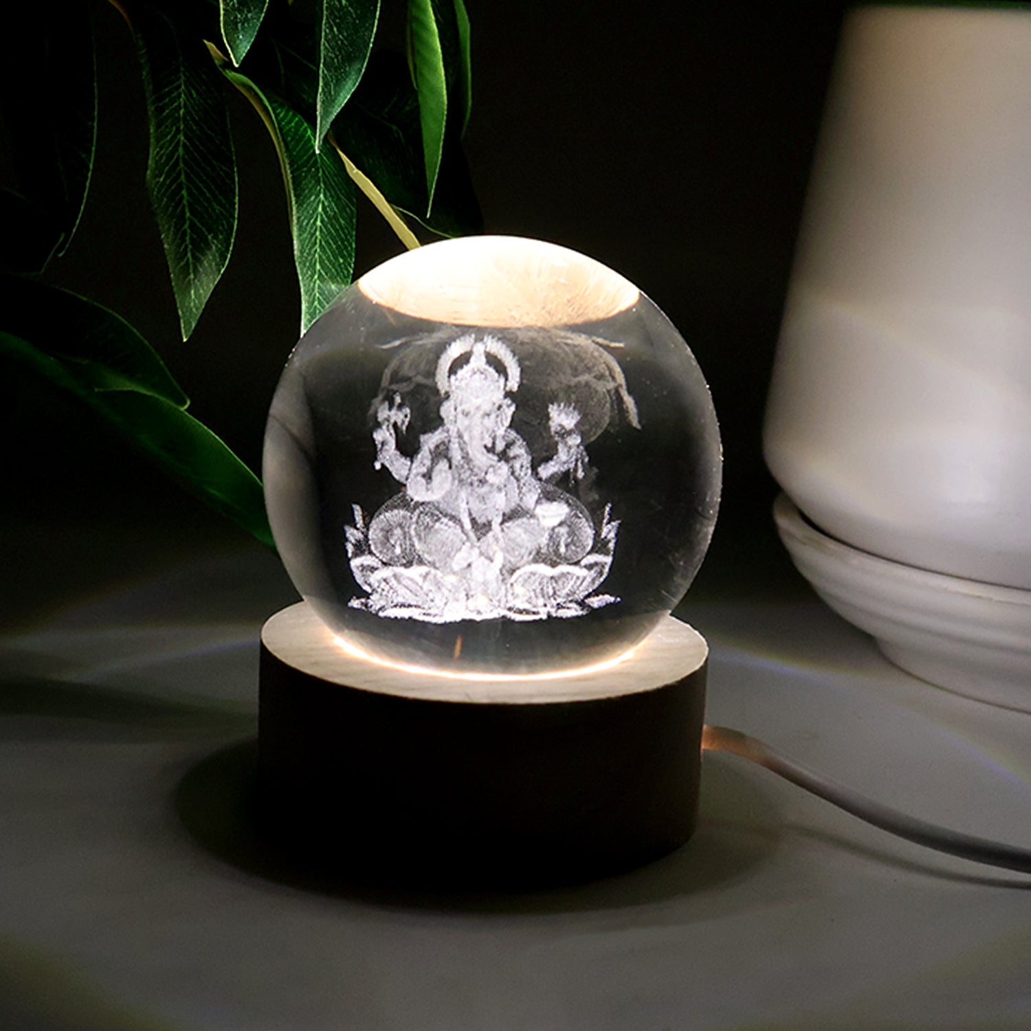 Close-up of Ganpati 3D Crystal Ball Lamp lighting effect