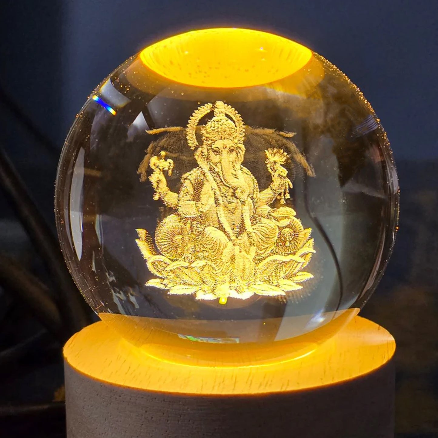 Side view of Ganpati 3D Crystal Ball Lamp with wooden base