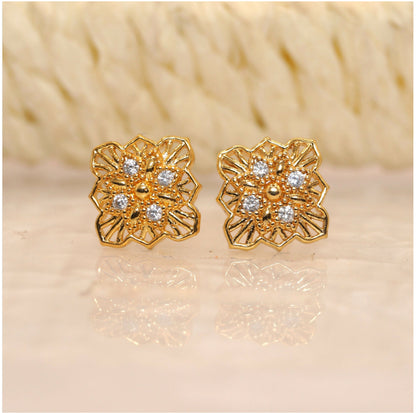 Gold plated filigree floral square stud earrings close-up showing intricate design and zircon accents