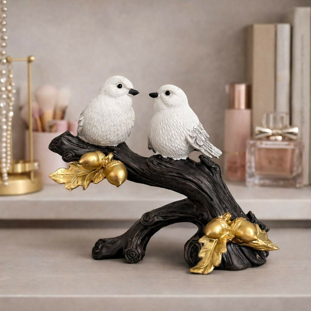 Close-up of bird figurine details with golden leaf accents