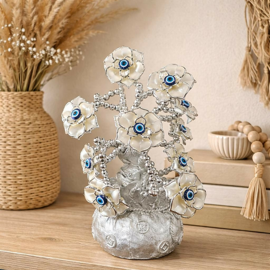 Silver lucky flower tree showpiece with blue evil eye accents on decorative silver branches