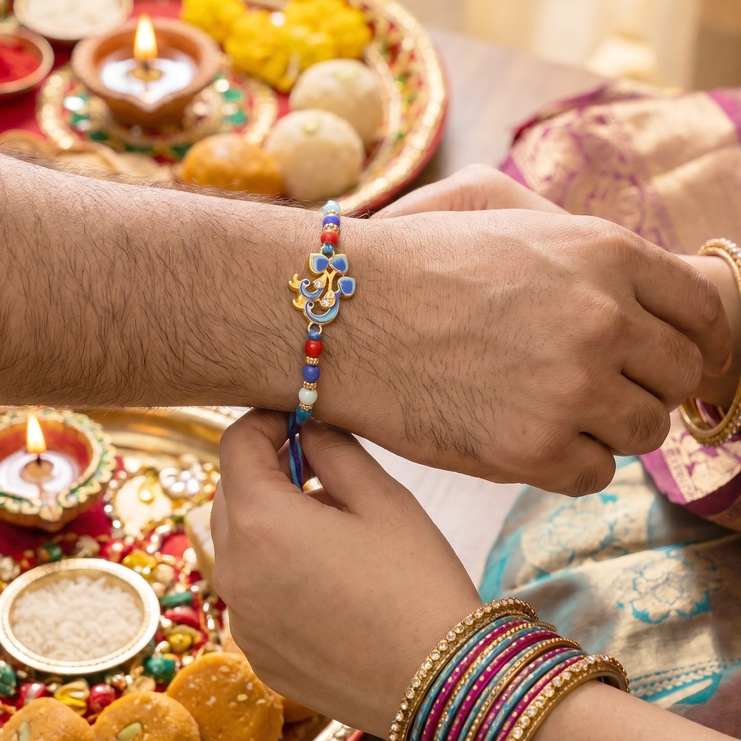 Closer view of Twin Peacock Golden Enamel Rakhi beads and centerpiece