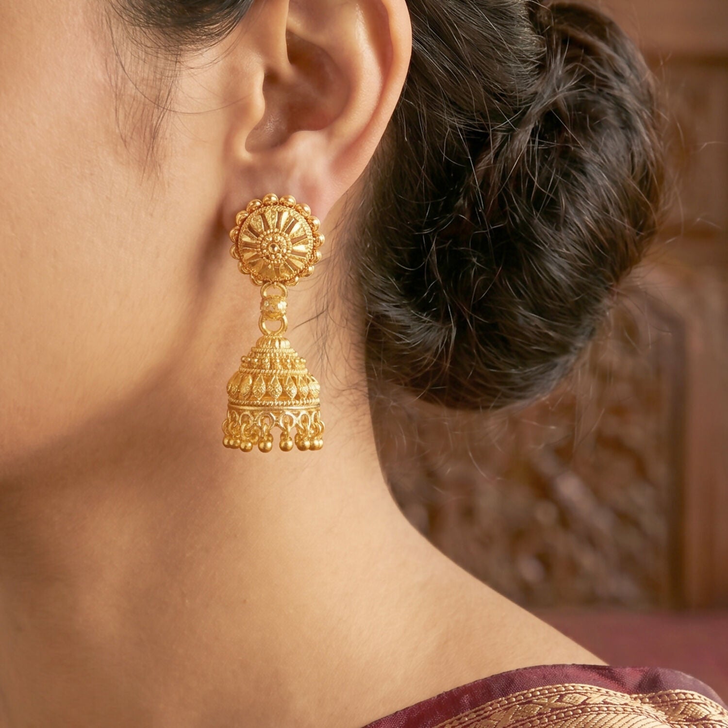 Close-up of intricate gold jhumka craftsmanship