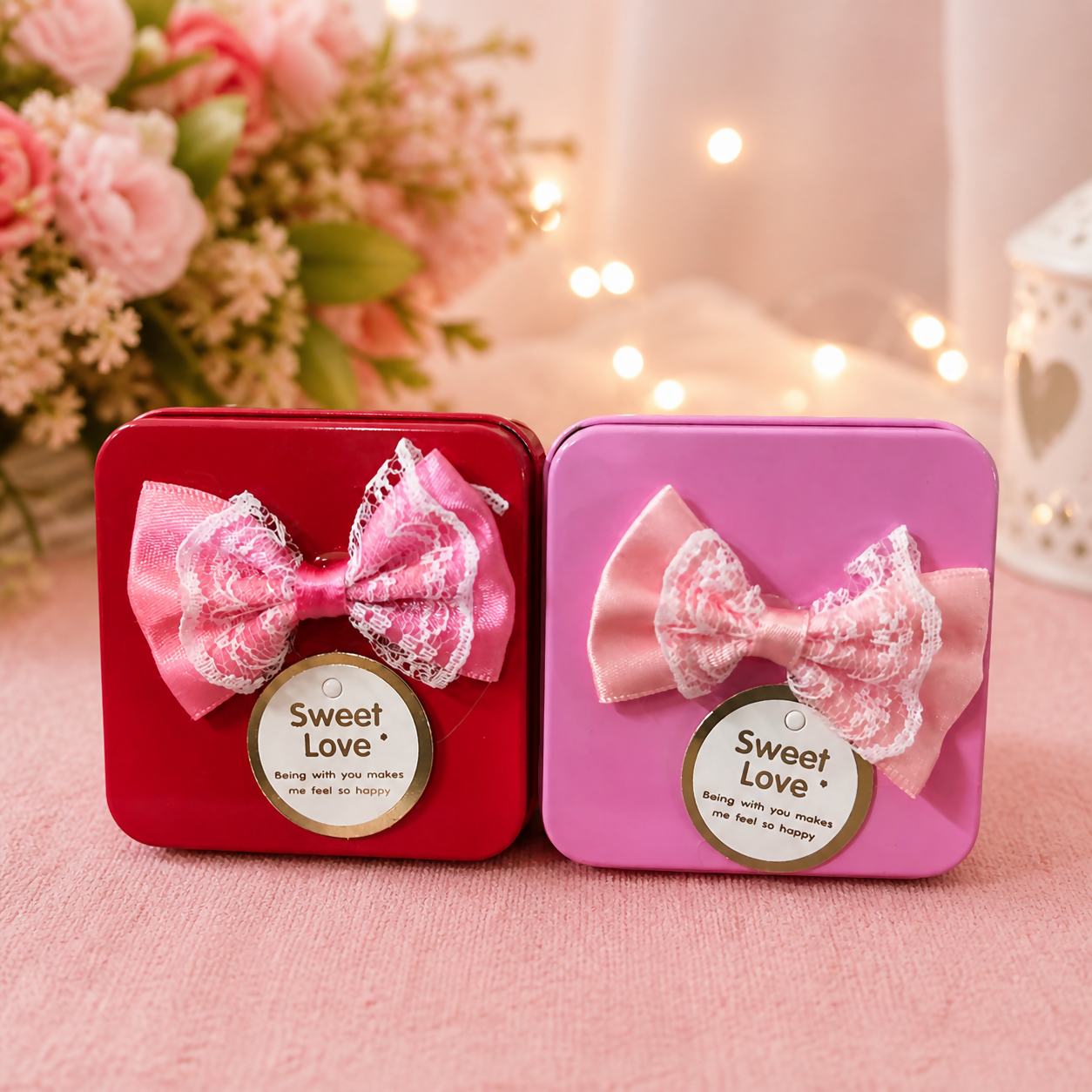 Mini gift box with bow and Sweet Love tag on glossy metal finish