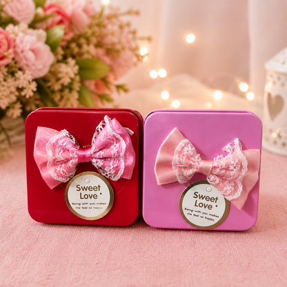 Mini gift box with bow and Sweet Love tag on glossy metal finish