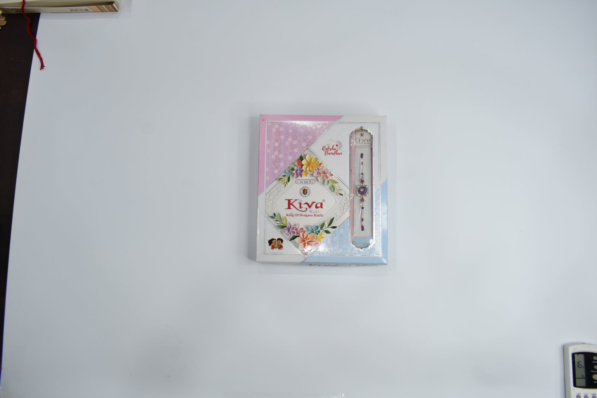 Set of 12 Elegant Silver-Toned Square Meenakari Rakhis