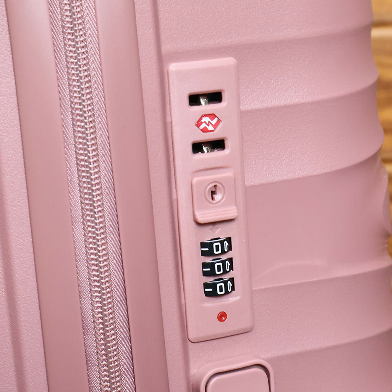 Eight multi-directional wheels for smooth mobility on rose gold cabin suitcase
