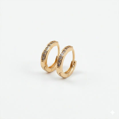 Pair of gold finish crystal studded hoop earrings highlighting subtle sparkle