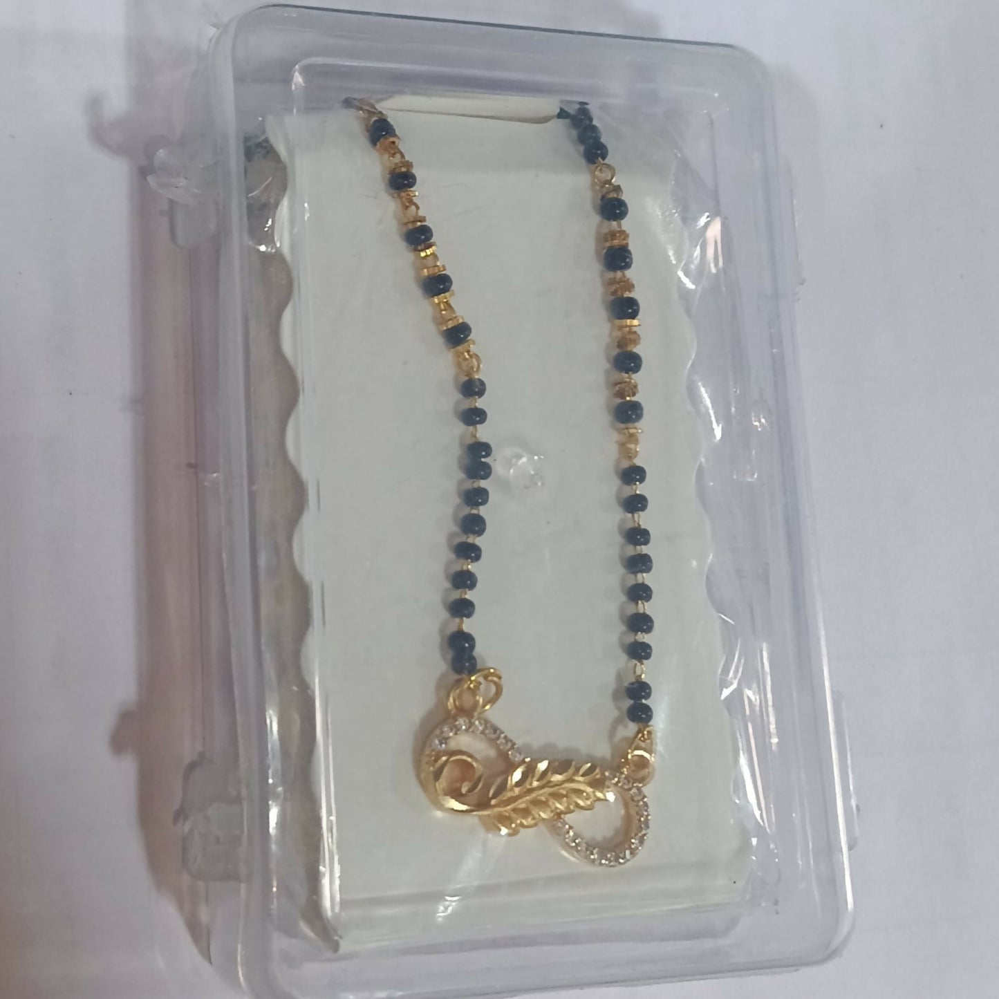 Gold Plated Infinity Leaf AD Mangalsutra with Black Beads for women
