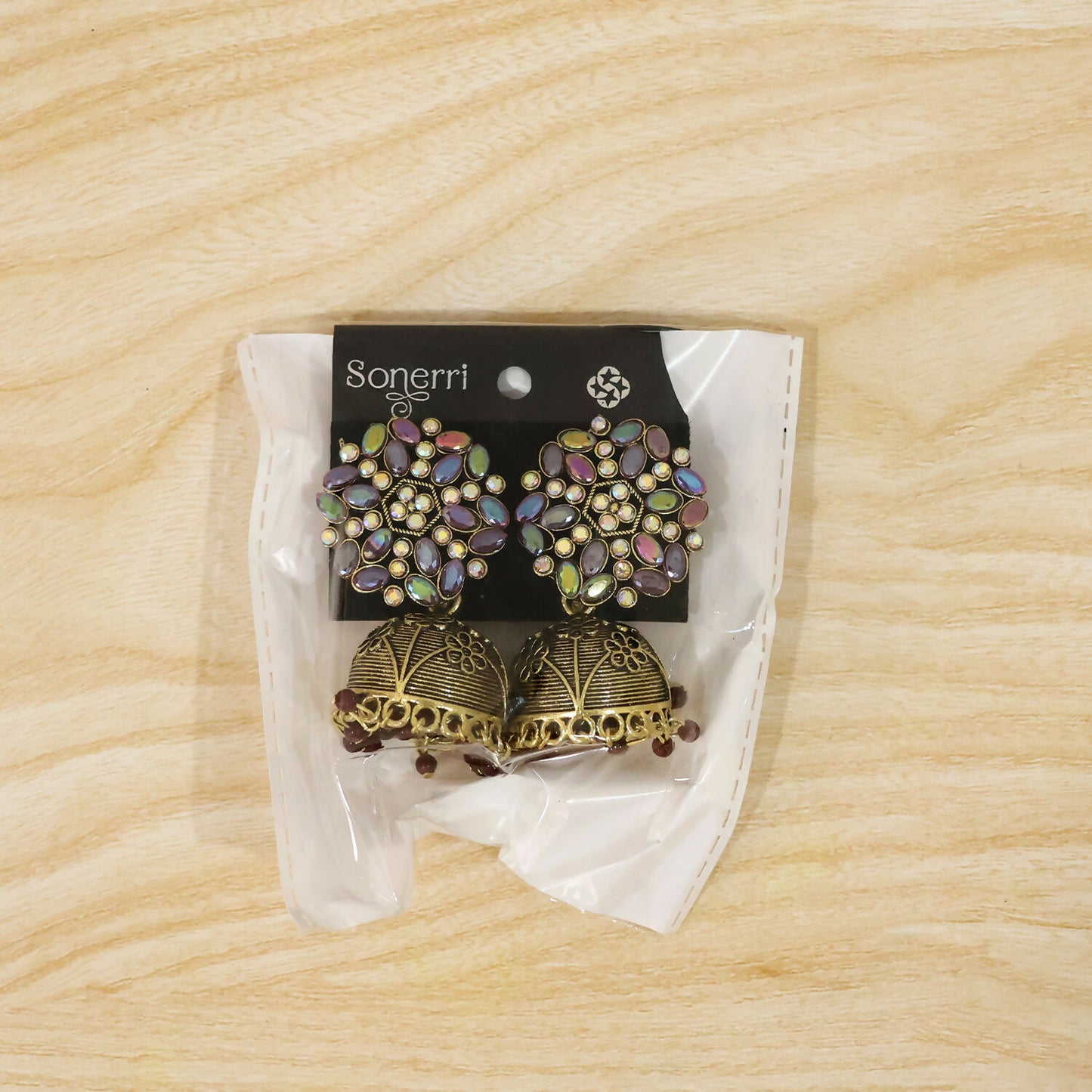 Side View of Antique Golden Jhumka Earrings with Purple Accents