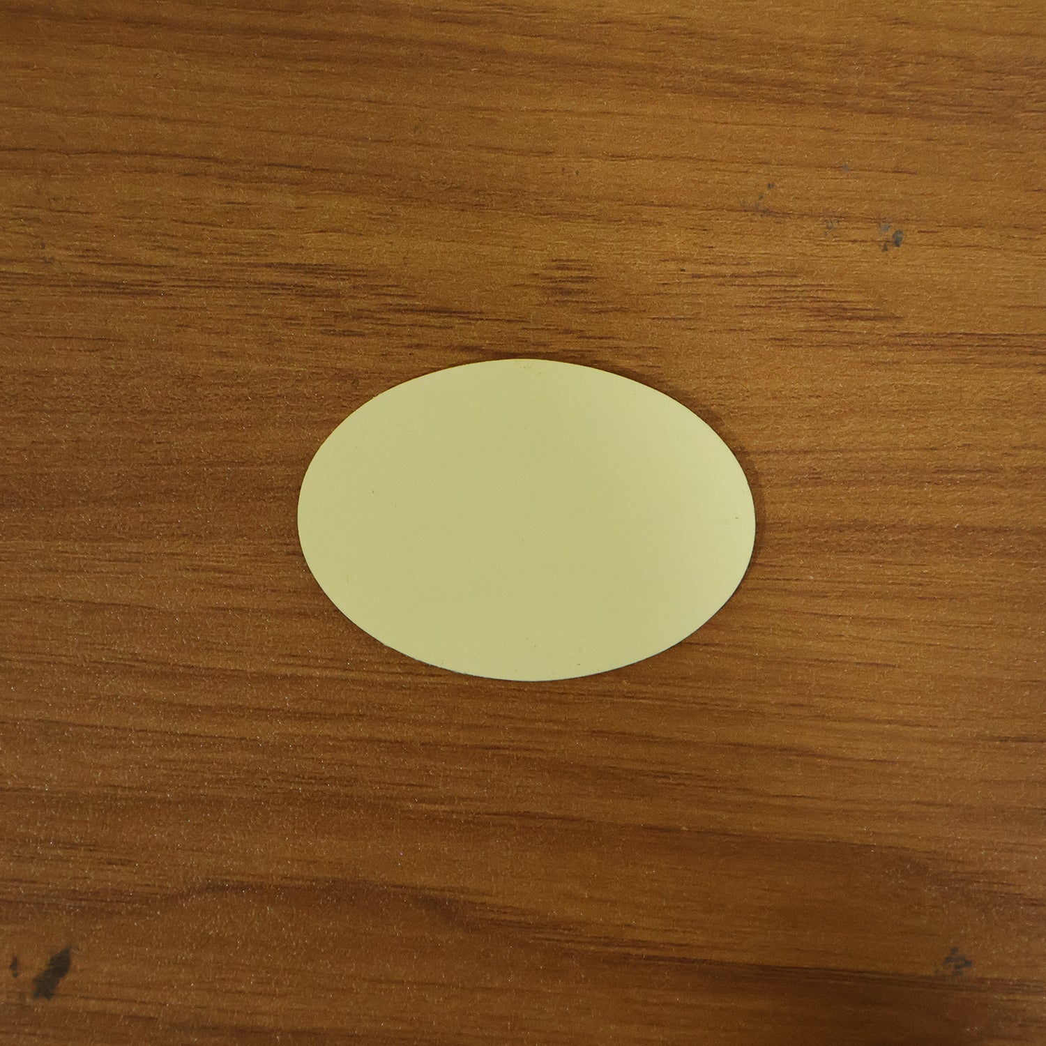 Round self adhesive anti-slip furniture pad on surface