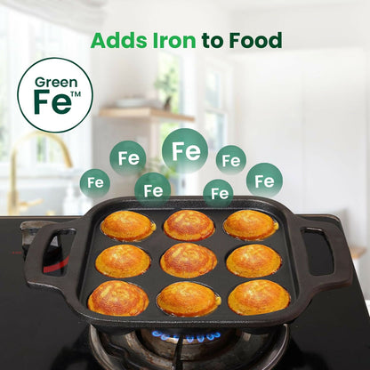 Top view of cast iron paniyaram pan with dual handles