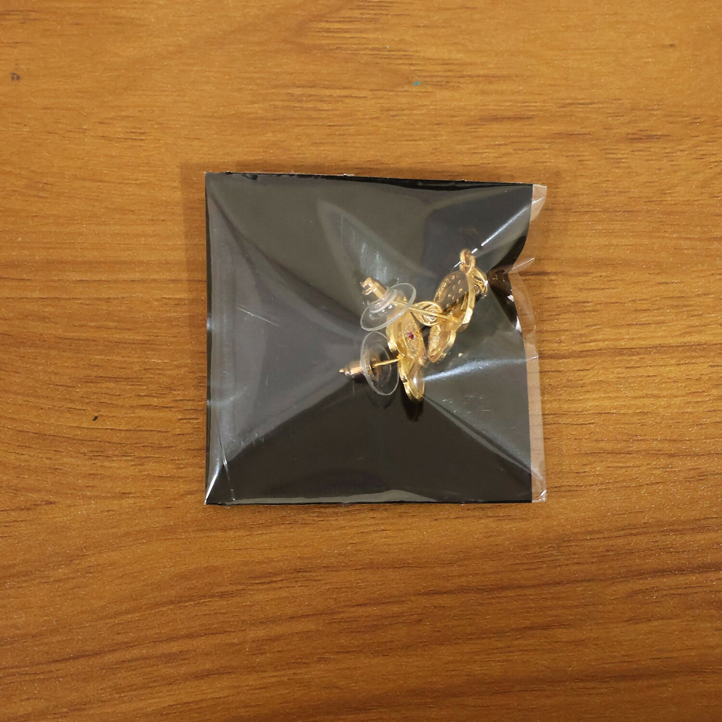 Ethnic Floral Motif Gold Stud Earrings With Stone Center And Elegant Drop Finish