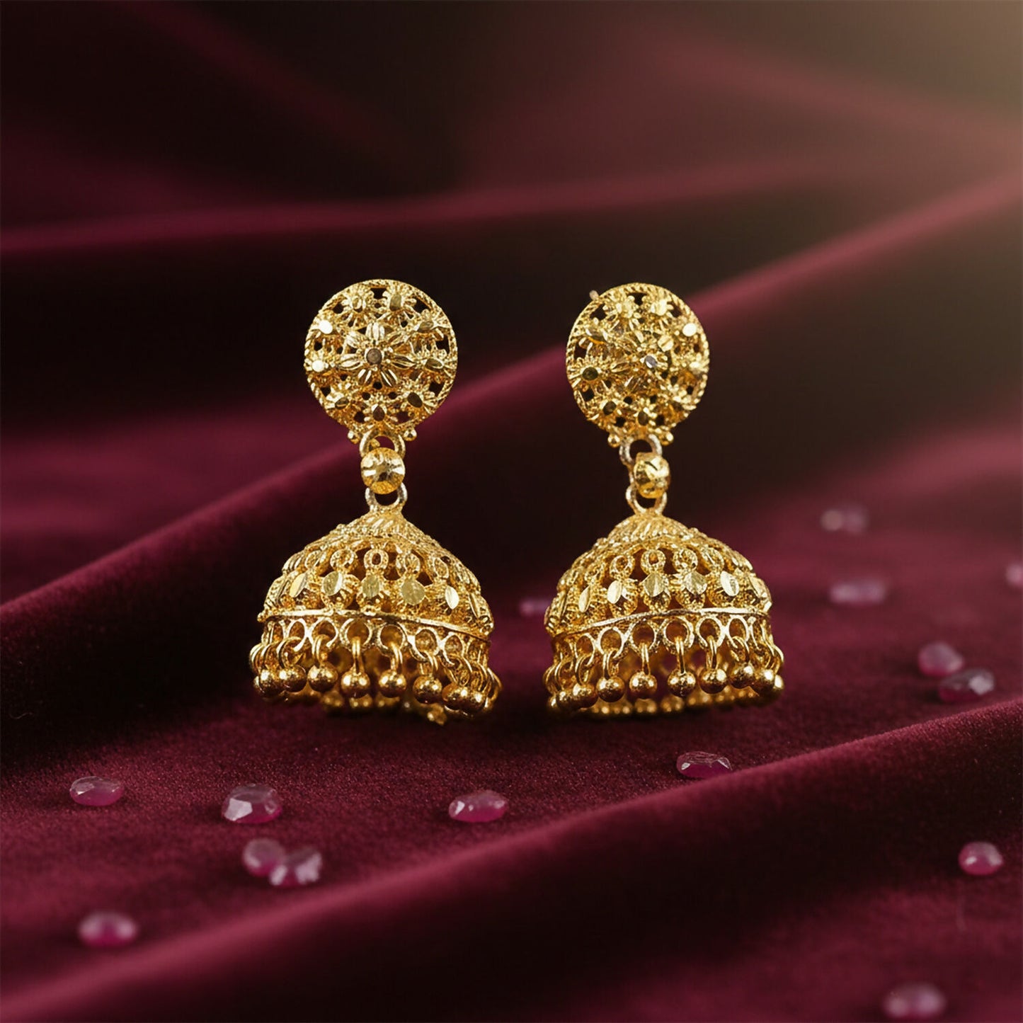 Close-up of craftsmanship on gold plated jhumka earrings