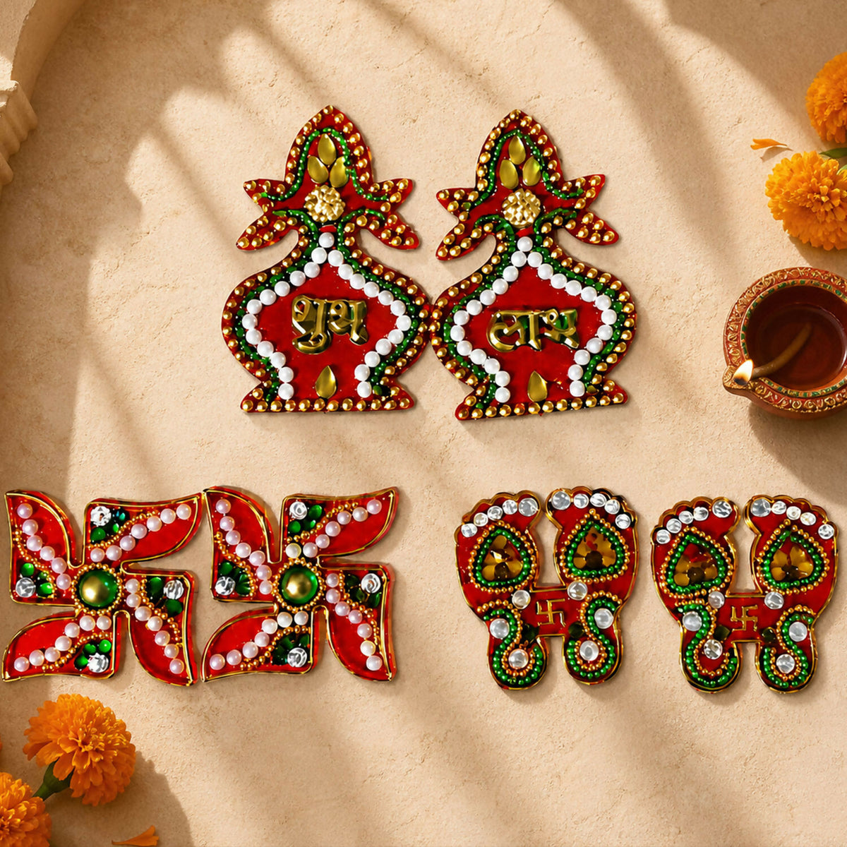 A set of red and gold Shubh Labh kalash, Swastik, and Laxmi Charan Paduka stickers on a light background with marigolds and