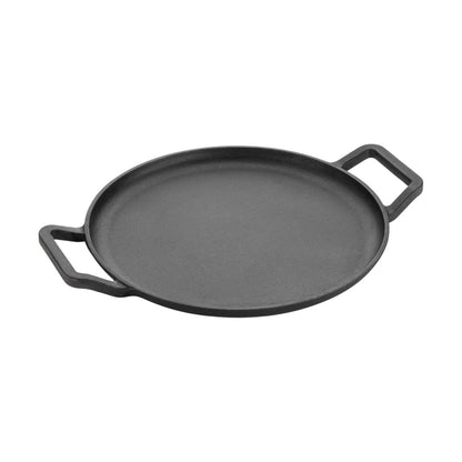Cast iron tawa on gas stove cooking flatbread