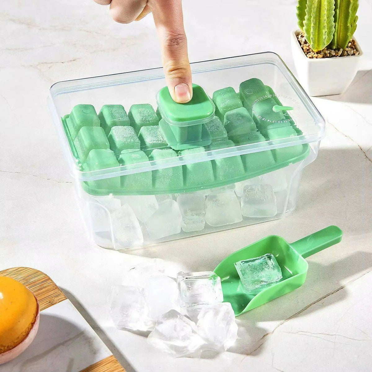 Ice cube tray and storage container in freezer