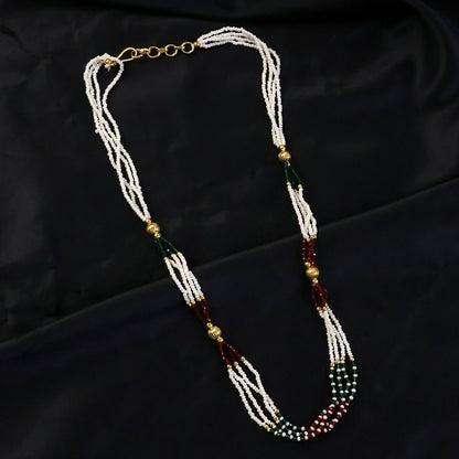 Layered pearl mala necklace showing red and green bead details