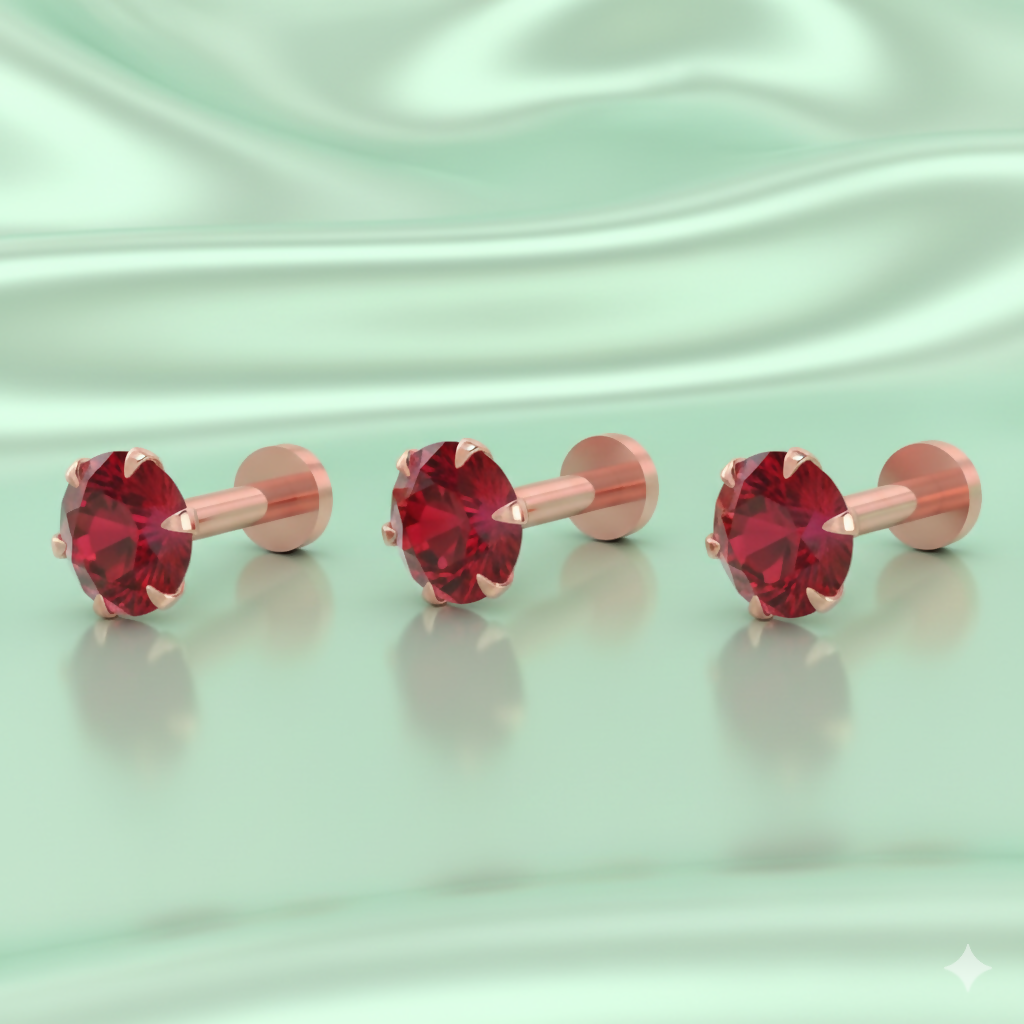 Set of three rose gold plated nosepin studs with radiant red crystals arranged