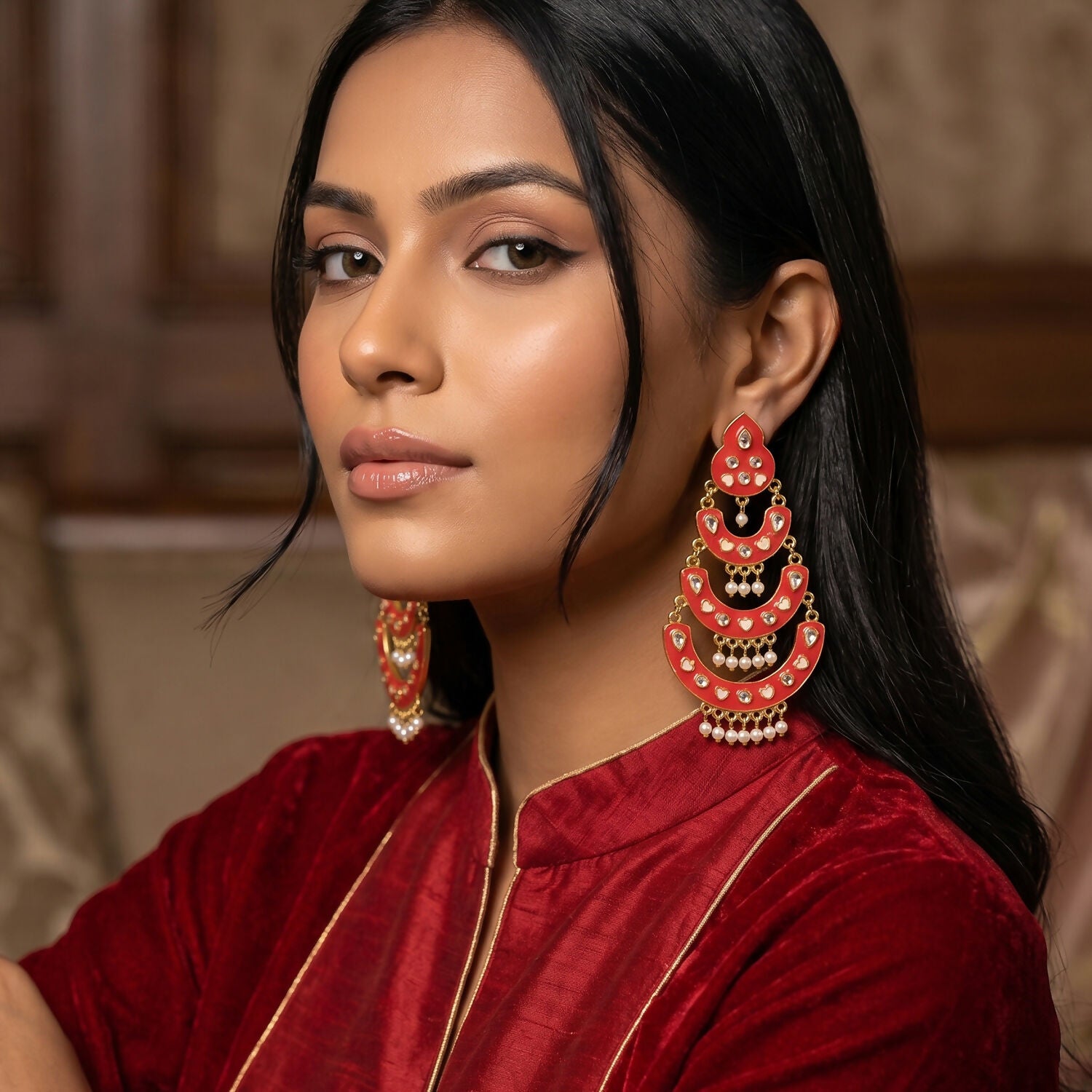 Elegant pearly drops hanging from peach Chandbali earrings