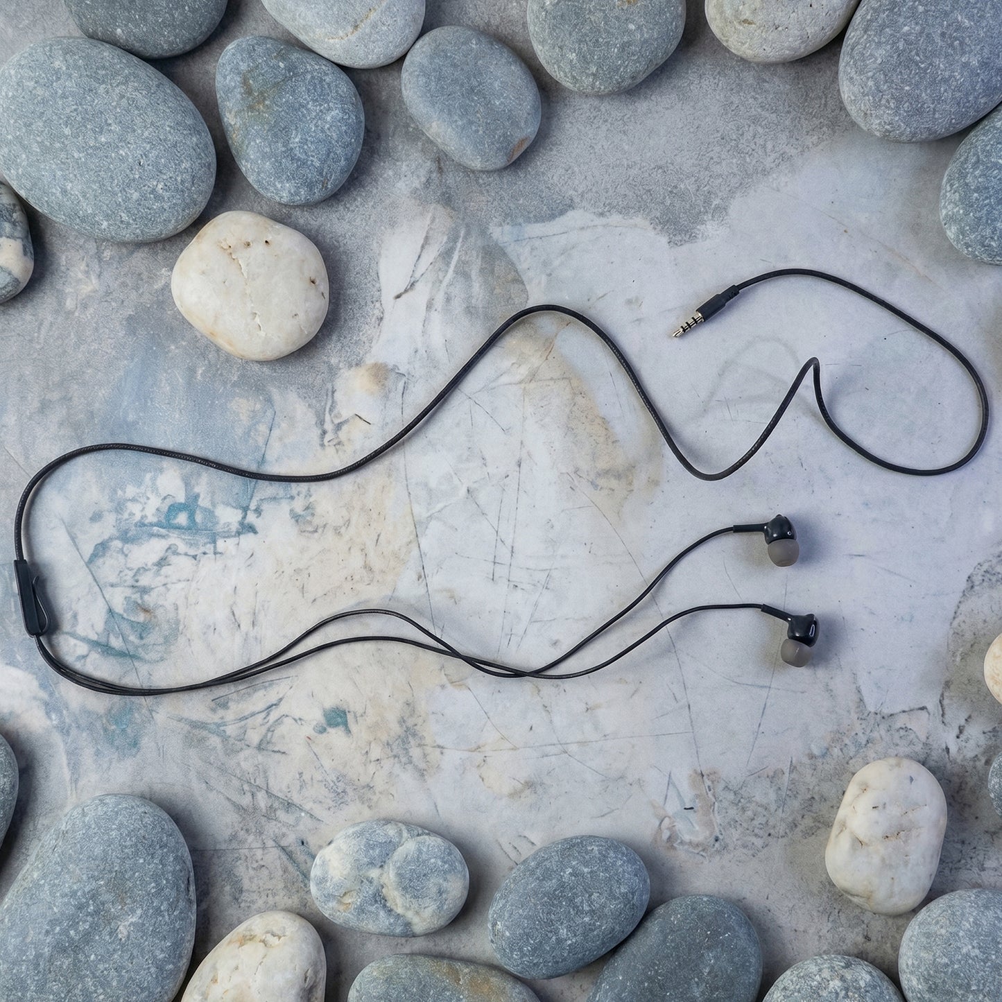 In-ear wired earphones showing earpiece design