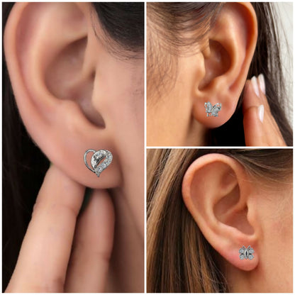 Close-up view of sterling silver large butterfly stud earrings with sparkling stones