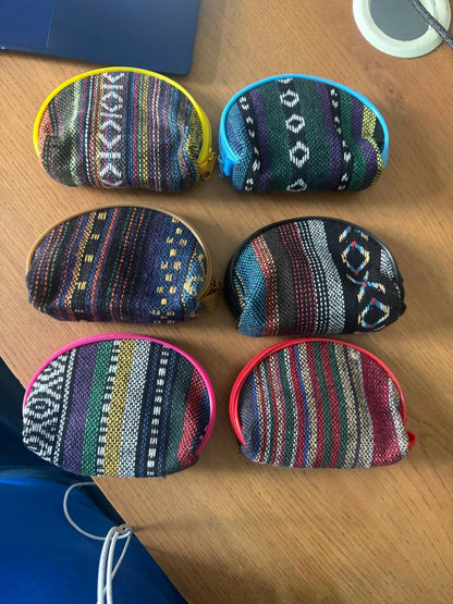 Ethnic print coin pouch in hand showing size