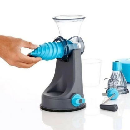 Juicer placed on kitchen counter with fruits