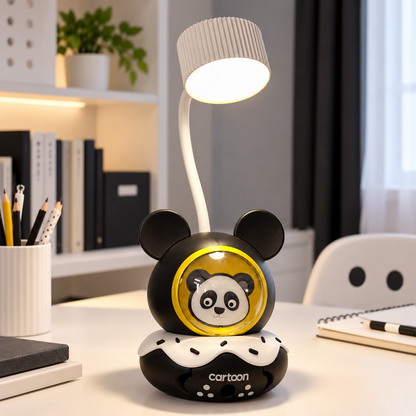 A black and white panda desk lamp illuminates a neat white study desk with a pen cup and notebook.