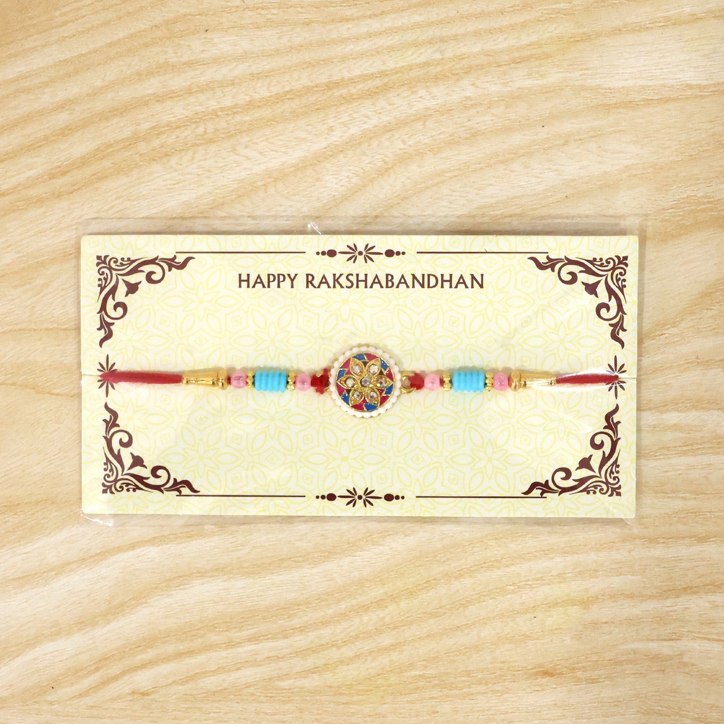 Festive multicolor floral kundan rakhi isolated on white