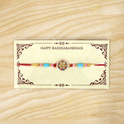 Festive multicolor floral kundan rakhi isolated on white