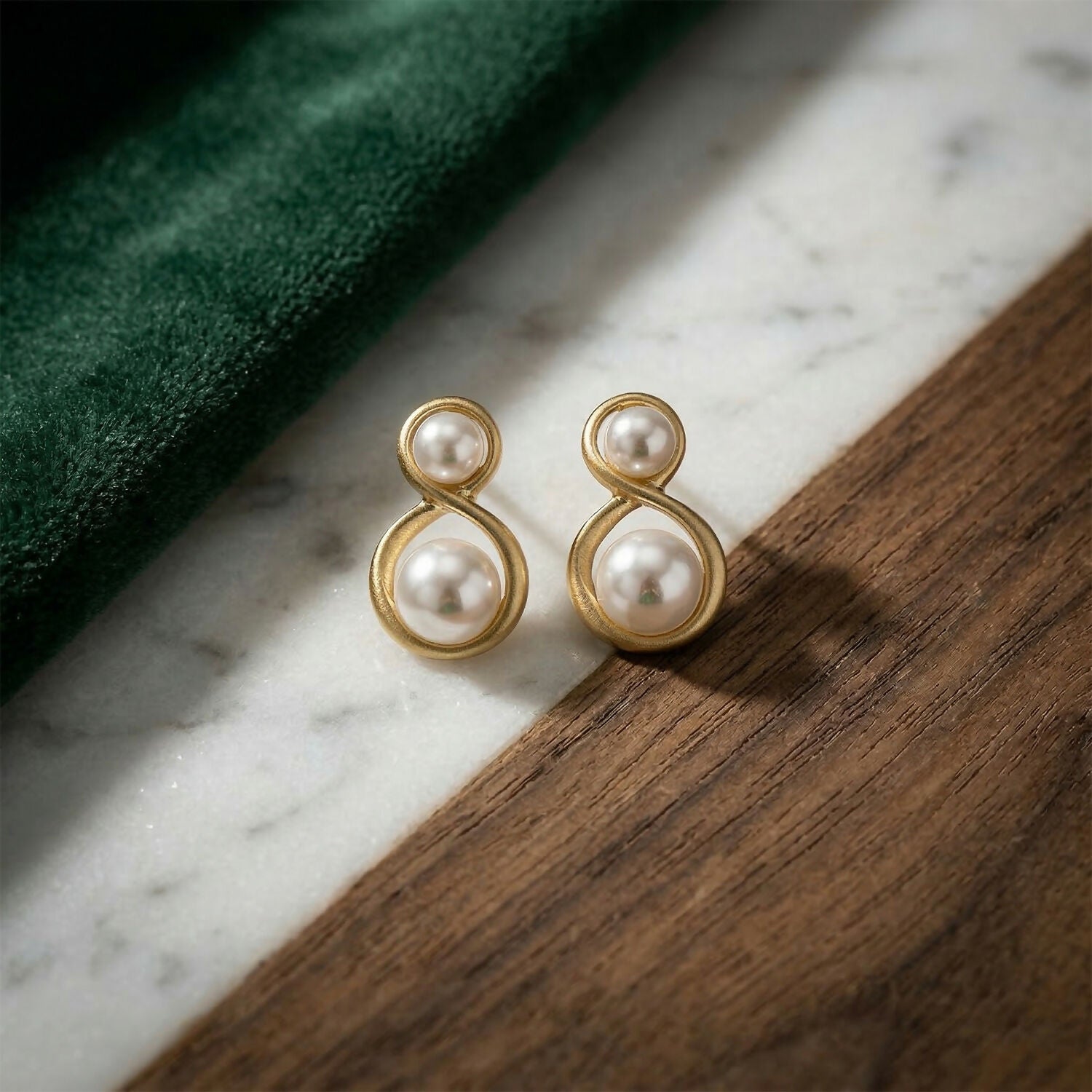 Side view of Korean pearl infinity stud earrings showcasing design