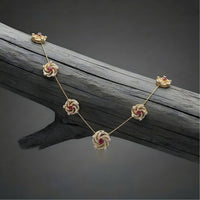 Ruby Floral Swirl Station Necklace with Diamond Detailing and Elegant Finish