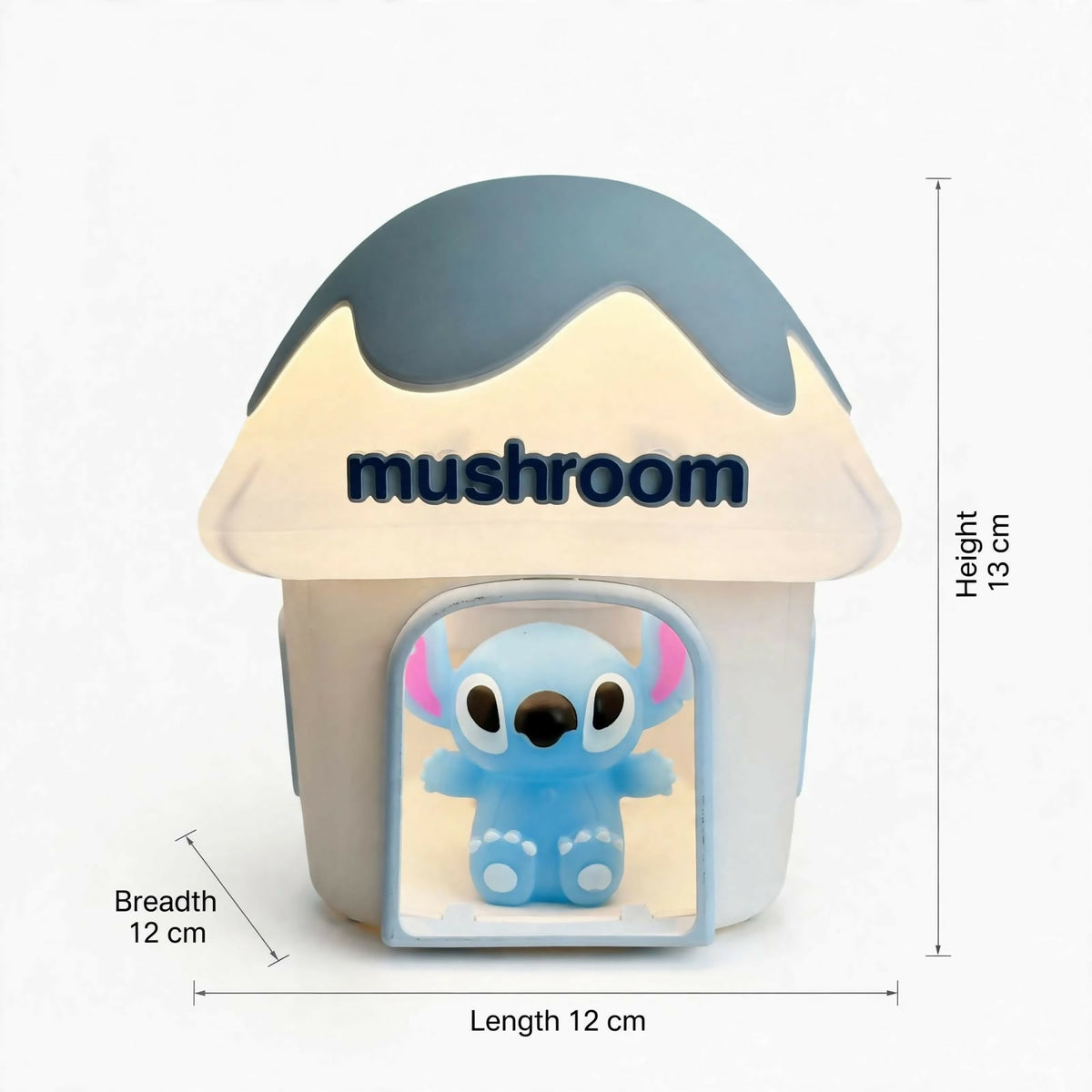 A mushroom house night light with a blue Stitch character, displaying its dimensions: 13cm height, 12cm breadth, 12cm length.