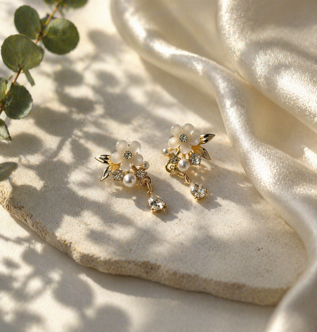 Side view of elegant floral pearl drop earrings