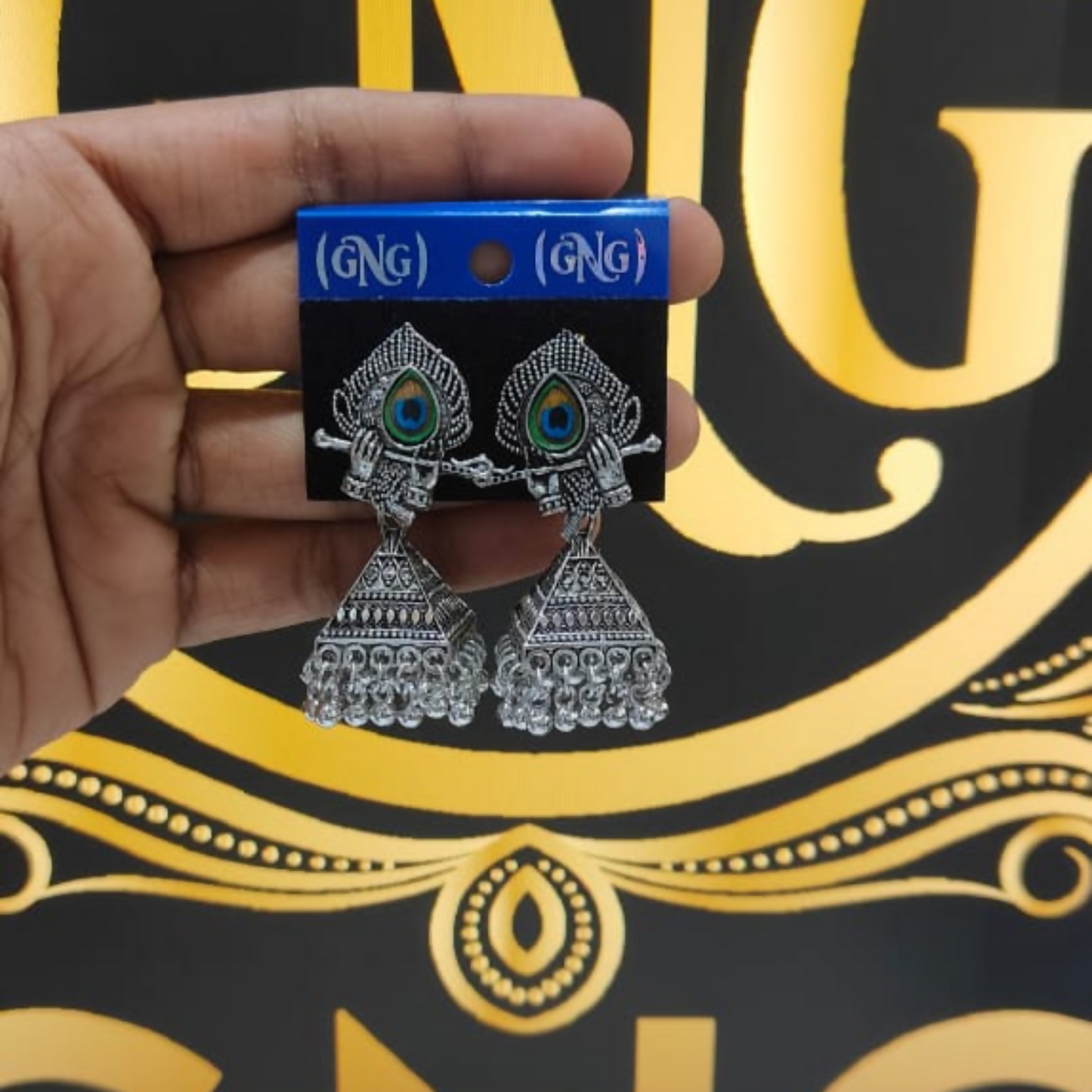 Pair of elegant oxidised silver Krishna jhumka earrings for festive wear