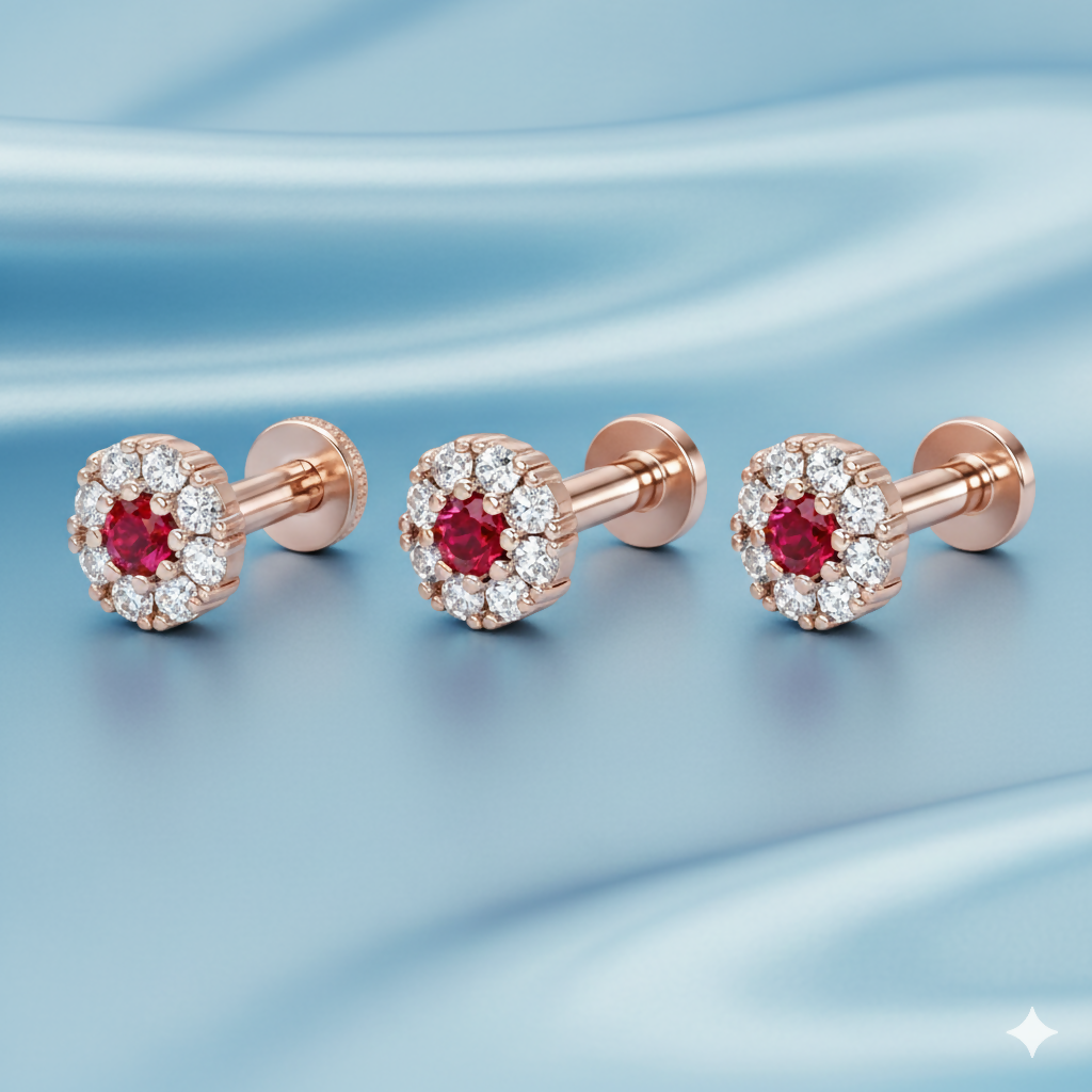 Detailed rose gold nose pin with floral design and central ruby red stone
