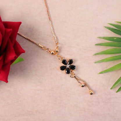 Elegant drop detail of gold finish black floral pendant necklace